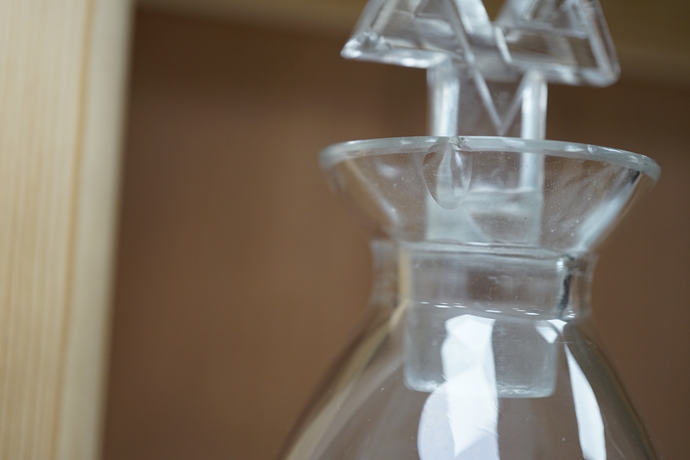 Two R. Lalique decanters, one with a Celtic knot stopper, the other the Star of David, tallest 27cm high (mark to base)